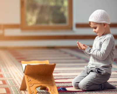 Ramadan Kareem,The Muslim boy prays in the mosque, the little boy prays to God,Peace and love in the holy month of Ramadan,lifestyle concept