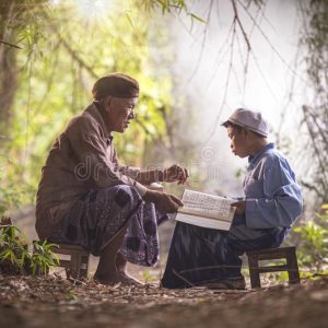 muslim-grandfather-teaching-nephew-to-read-book-muslims-reading-quran-168526662